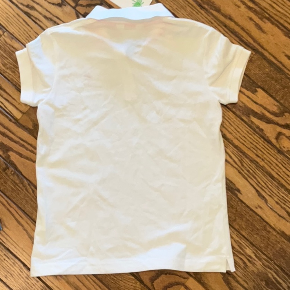 White Women’s Polo Shirt with Pink Logo - Picture 2 of 3